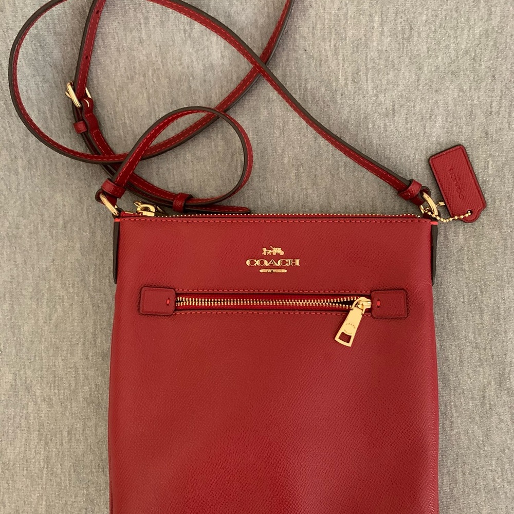 Coach Red Leather Crossbody Bag with Gold Accents.